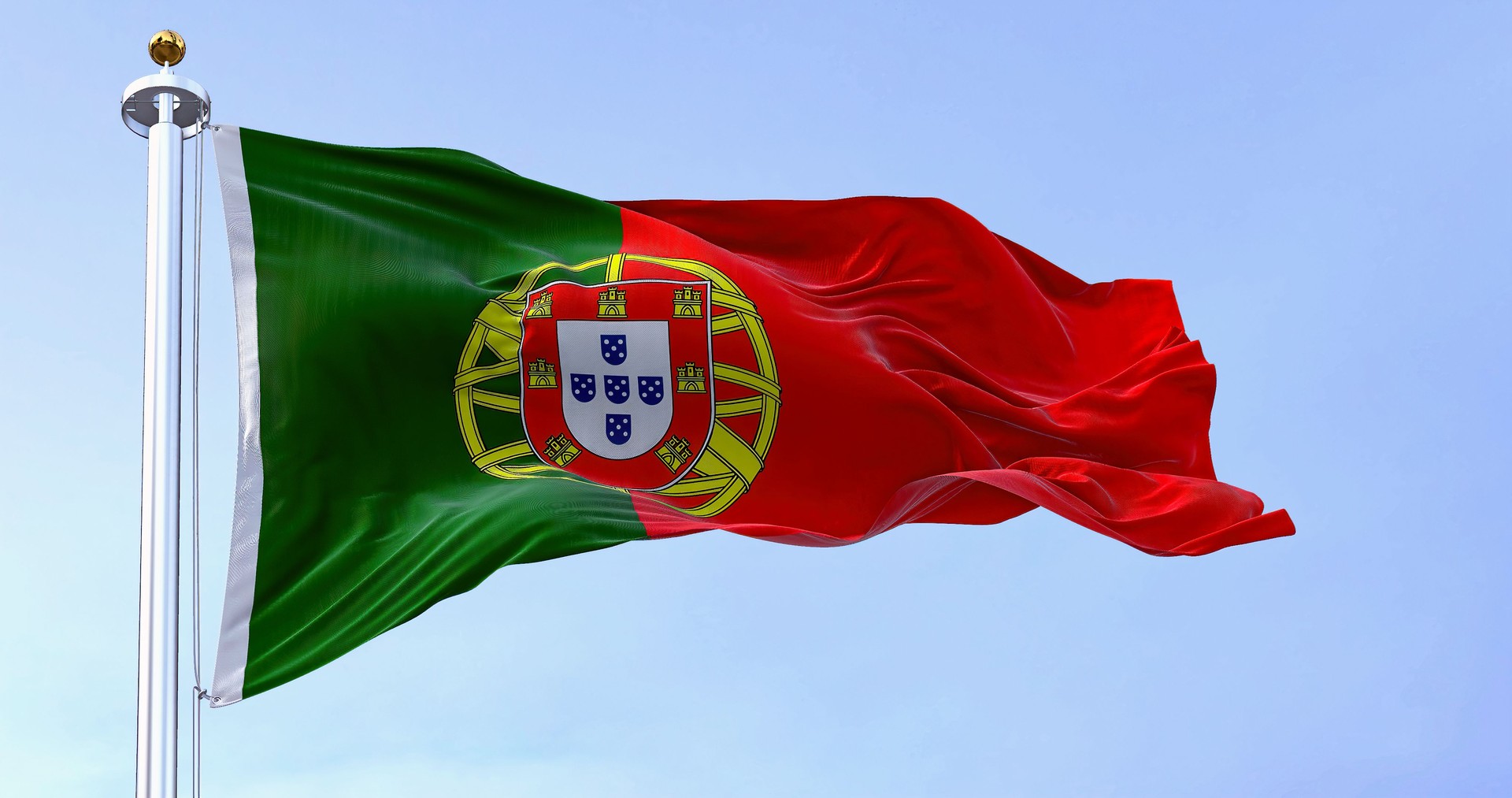 Portugal national flag waving in the wind on a clear day